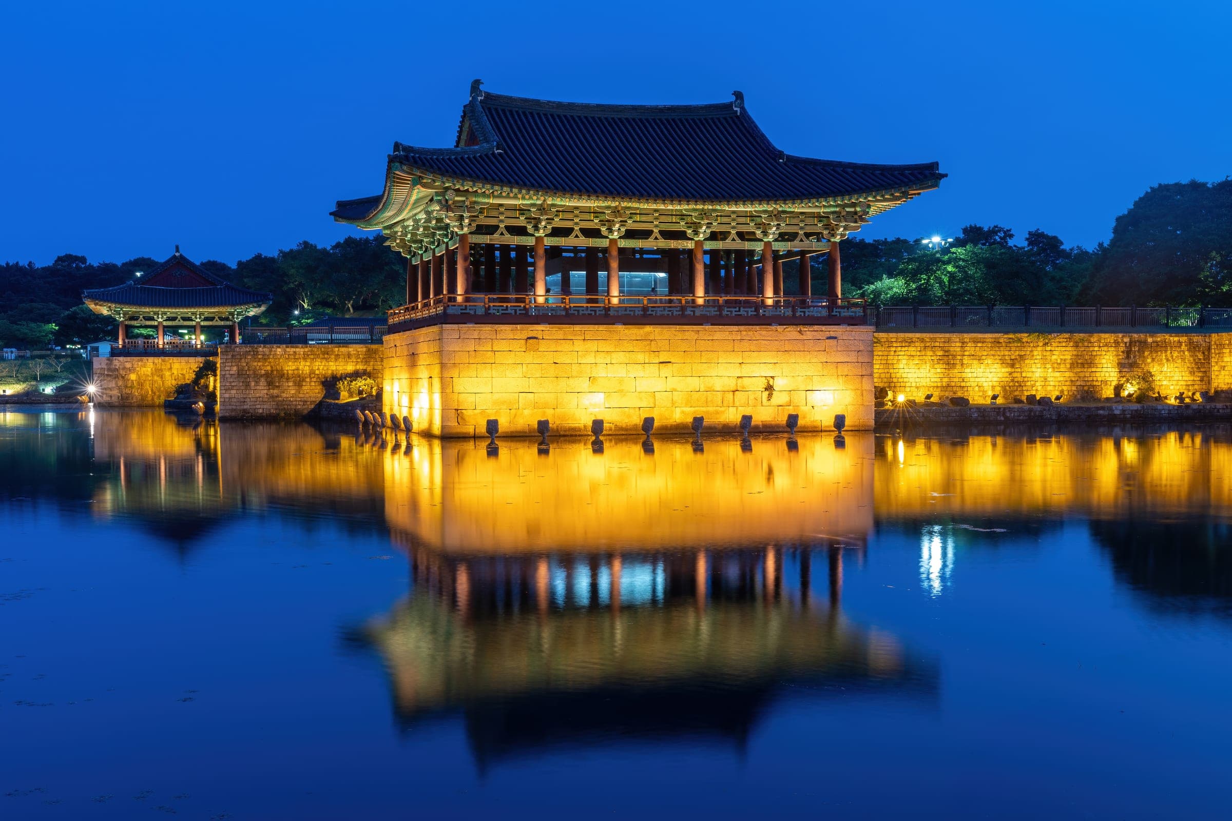 Donggung Palace lit at dusk and reflected in Wolji Pond, Gyeongju