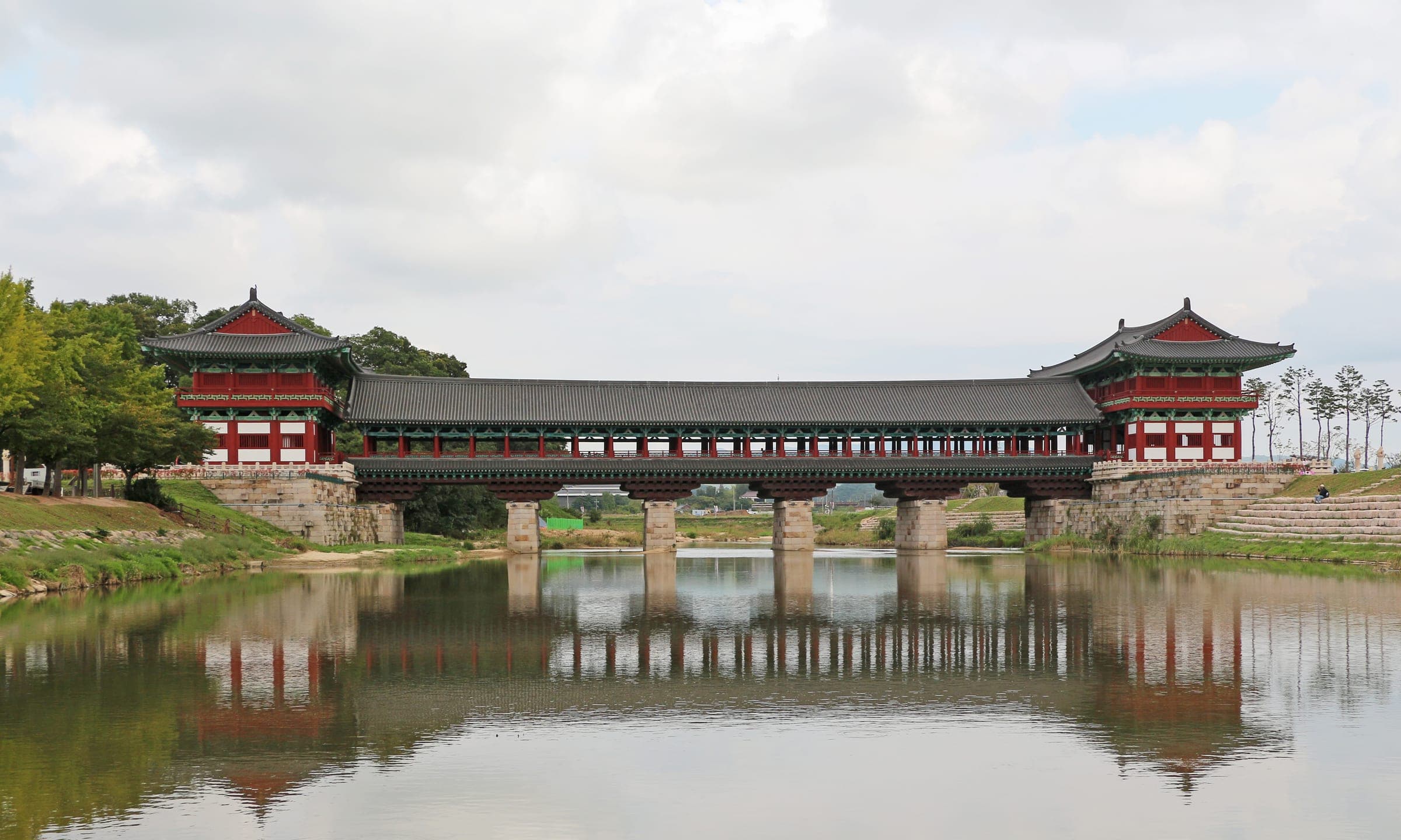 The roofed Woljeonggyo Bridge and its reflection in the river in Gyeongju