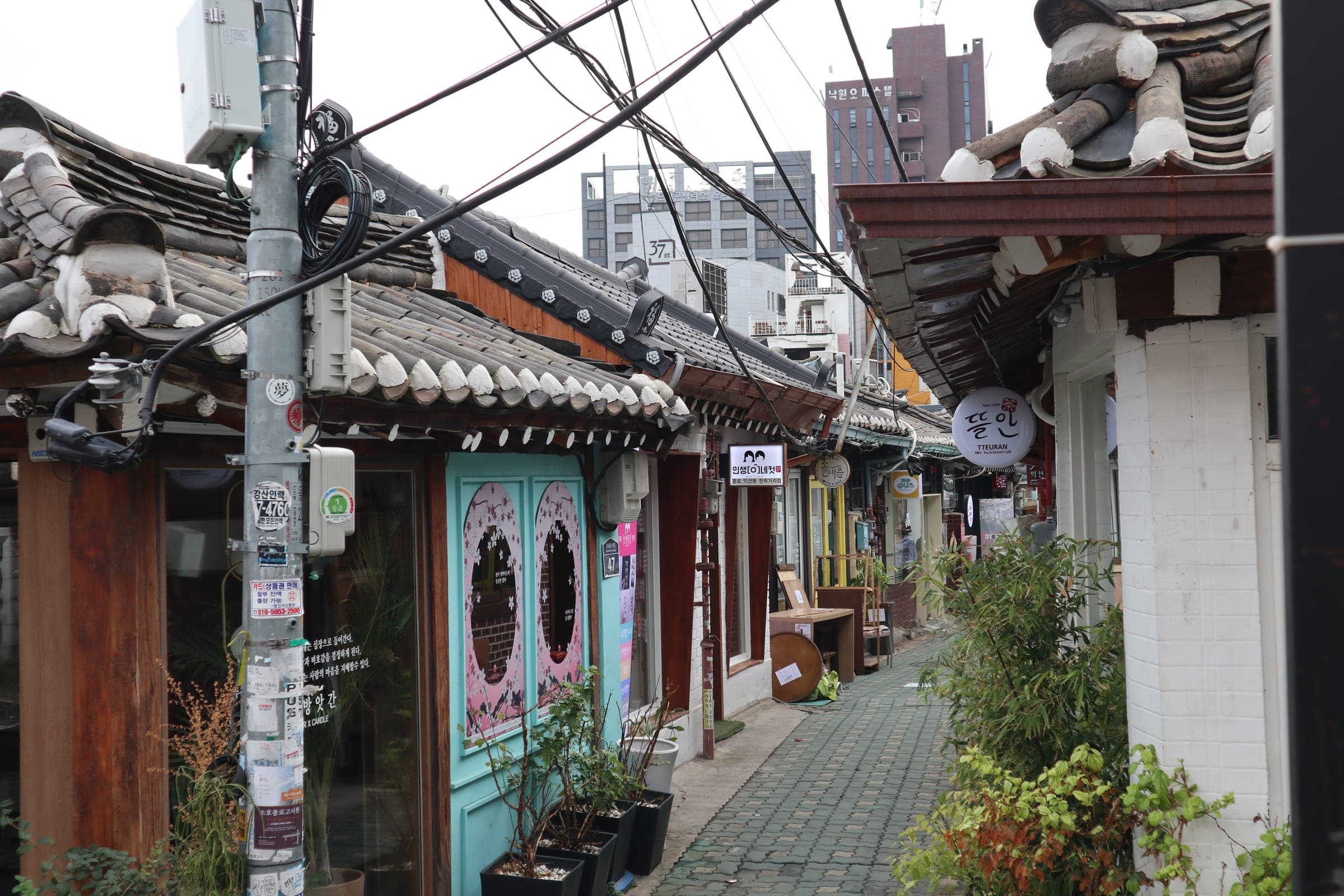 A narrow alley lined with small hanok shops in Ikseon-dong, Seoul